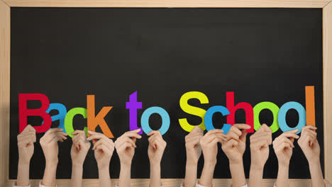 Hands-holding-up-back-to-school