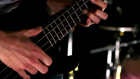 Close-up-of-man-playing-the-bass