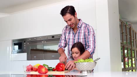 Father-and-daughter-preparing-vegetables