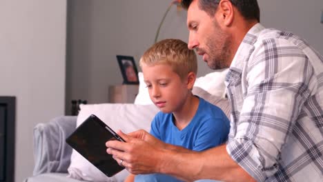 Father-and-son-using-tablet