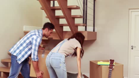 Smiling-couple-moving-in-their-new-house-