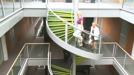 Business-people-going-upstairs-in-office