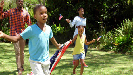 Family-running-with-American-flags