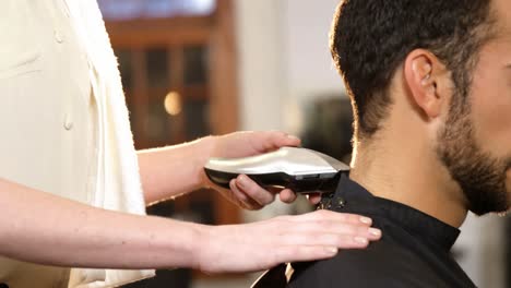 Man-getting-his-hair-trimmed-with-trimmer
