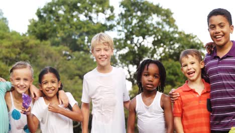 Group-of-kids-standing-together-with-arms-around