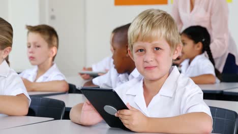 Schoolkids-using-digital-tablet-in-classroom
