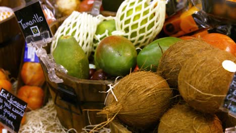 Close-up-of-coconut-and-other-fruits-in-organic-section