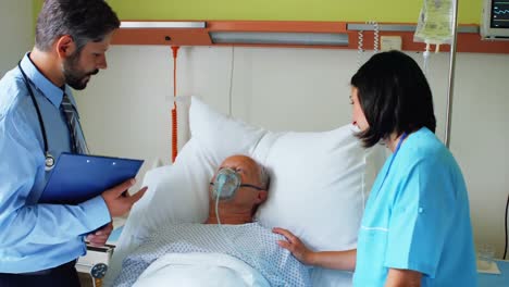 Doctor-and-nurse-interacting-with-patient