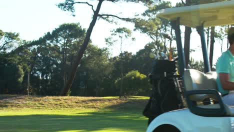 Golfer-driving-in-his-golf-buggy-