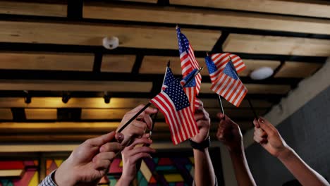 Group-of-friends-waving-american-flag