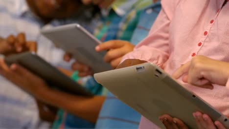 Kids-using-digital-tablet-in-classroom