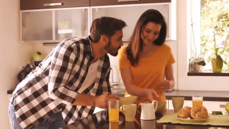 Couple-having-breakfast-in-the-kitchen