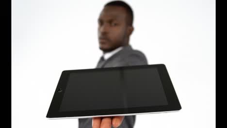 Close-up-of-businessman-showing-digital-tablet