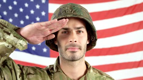 Soldier-saluting-in-front-of-American-flag