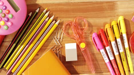 Close-up-of-various-stationery-and-apple