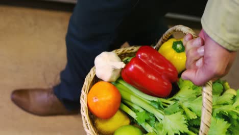 Man-holding-fresh-vegetables-in-basket