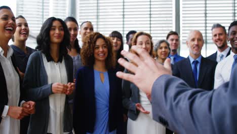 Businesspeople-applauding-on-their-colleagues-presentation