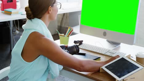 Female-graphic-designer-working-on-computer