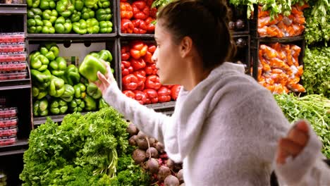 Woman-buying-capsicum-in-organic-section