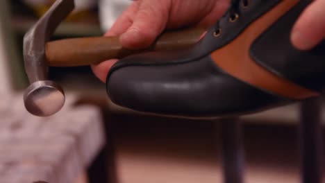 Cobbler-hammering-on-a-shoe