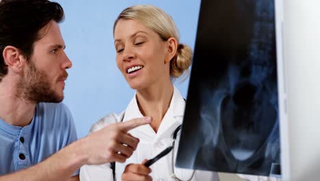 Physiotherapist-discussing-x-ray-with-patient