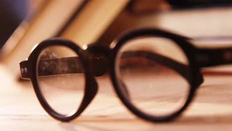 Various-books-with-spectacles-on-a-desk
