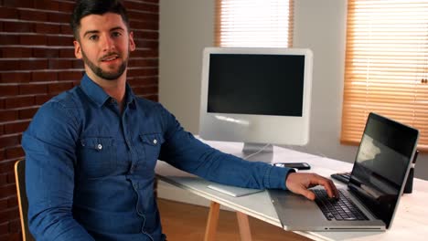 Male-graphic-designer-using-laptop