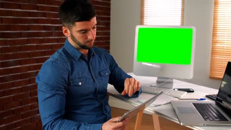 Male-graphic-designer-using-digital-tablet