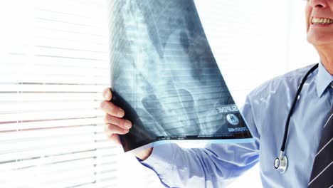Male-doctor-examining-x-ray