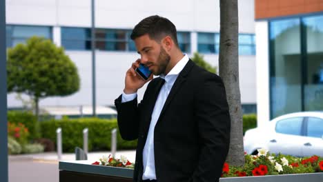 Businessman-talking-on-mobile-phone