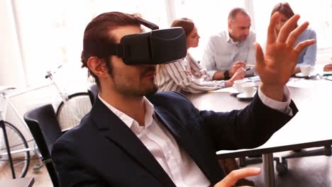 Business-executive-using-virtual-reality-headset