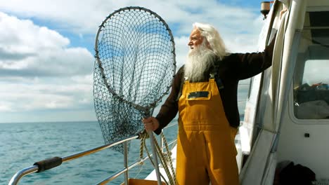 Fisherman-holding-fishing-net