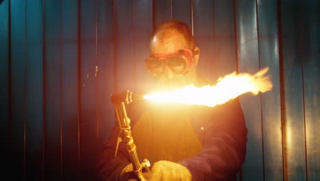 Male-welder-using-welding-torch