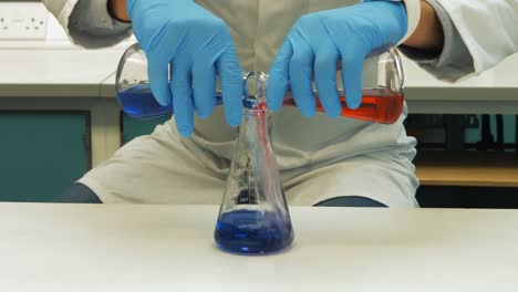 Scientist-doing-chemical-experiment