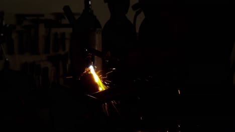 Welder-holding-welding-torch