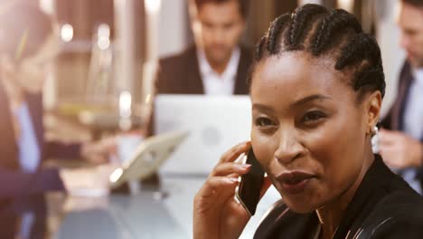 Businesswoman-talking-mobile-phone