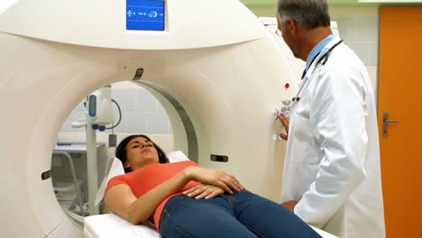Doctor-consoling-a-patient-before-mri-scan-at-the-hospital-4k