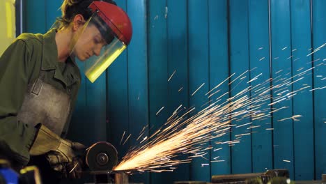 Female-welder-working-at-work-shop