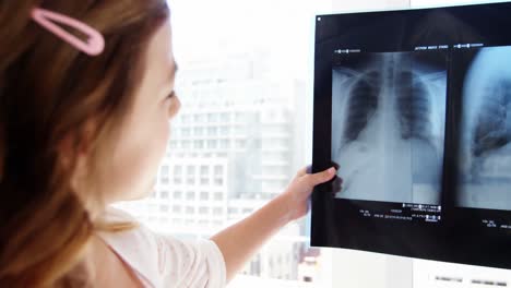 Girl-examining-x-ray
