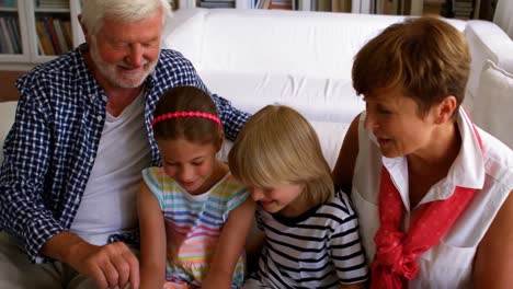 Grandchildren-using-laptop-with-their-grandparents