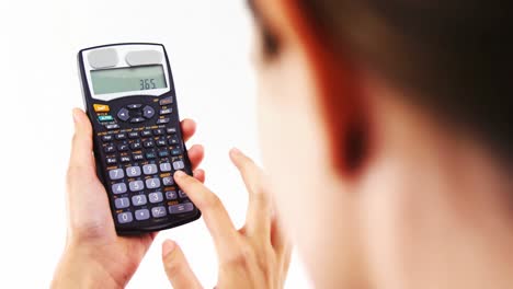 Businesswoman-using-calculator