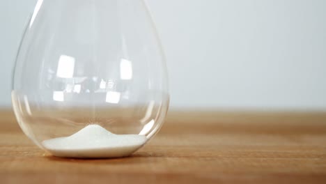 Sand-pouring-in-glass-jar