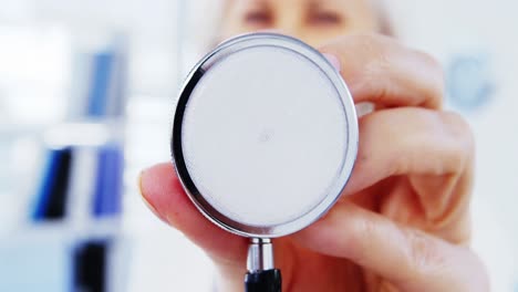 Close-up-of-female-doctor-holding-stethoscope