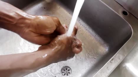 Chef-washing-his-hands-in-kitchen