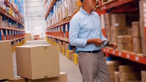 Manager-checking-inventory-stock