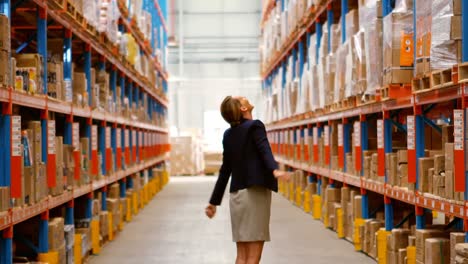 Female-manager-looking-at-warehouse