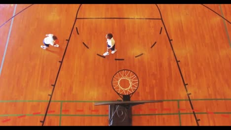 Boys-playing-basketball-in-court