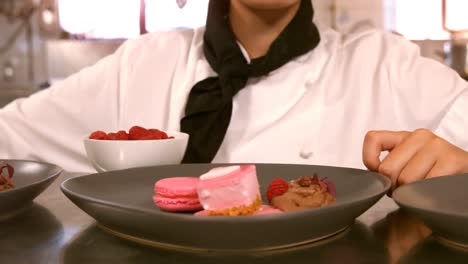 Female-chef-with-dessert-food-on-a-counter