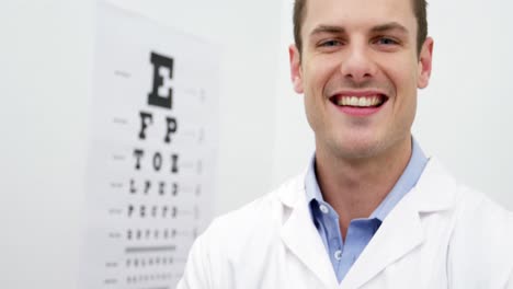 Optometrist-standing-in-ophthalmology-clinic