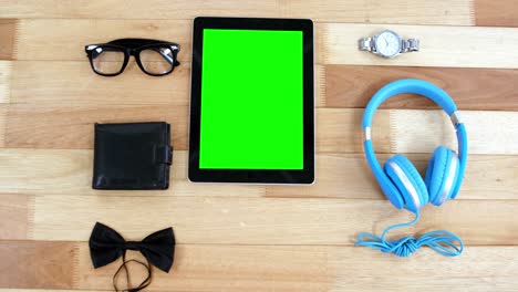 Digital-tablet,-headphones,-wallet,-spectacles,-wrist-watch-and-bowtie